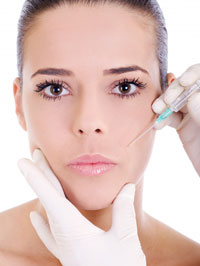 Woman receiving a facial injection