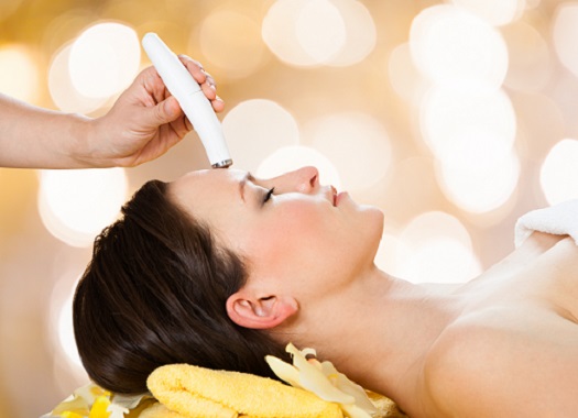 Woman Receiving Microdermabrasion Therapy